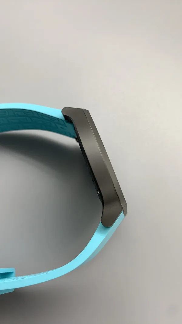 Élégante 48 mm replica, white dial, dark case, sky blue rubber strap