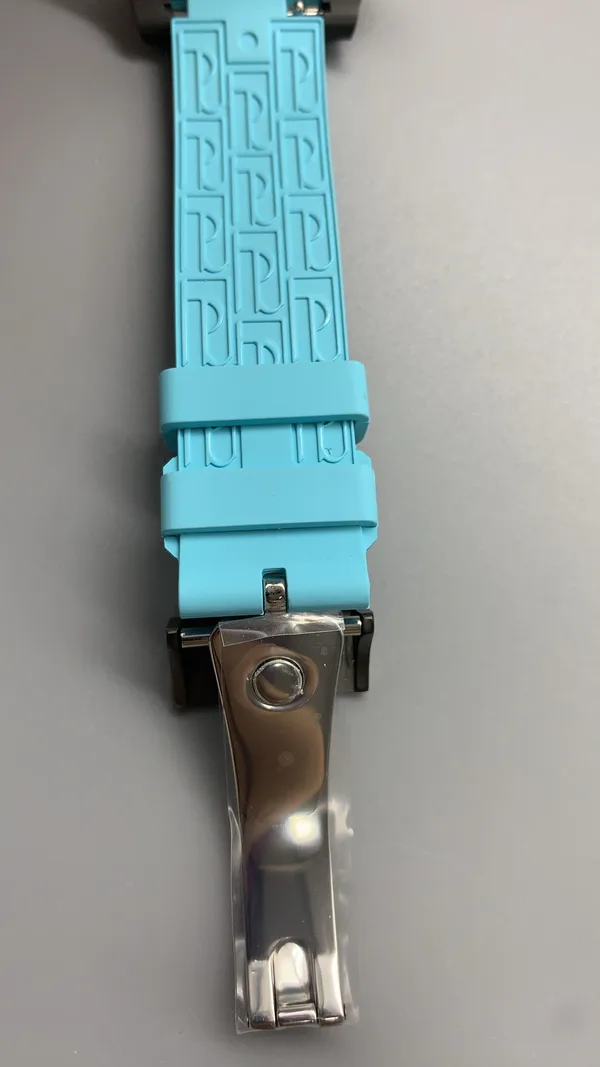 Élégante 48 mm replica, white dial, dark case, sky blue rubber strap