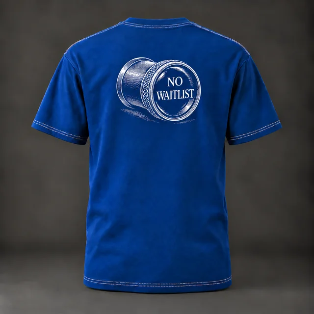 Blue Repinkee T-shirt, back, with an engraved-style watchmaker’s loupe reading No Waitlist