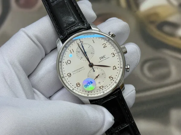 OCTA Portugieser Chronograph, silver dial with gold hands, black leather strap, angled dial view