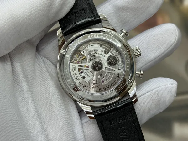 OCTA Portugieser Chronograph, silver dial with gold hands, black leather strap, display caseback and movement