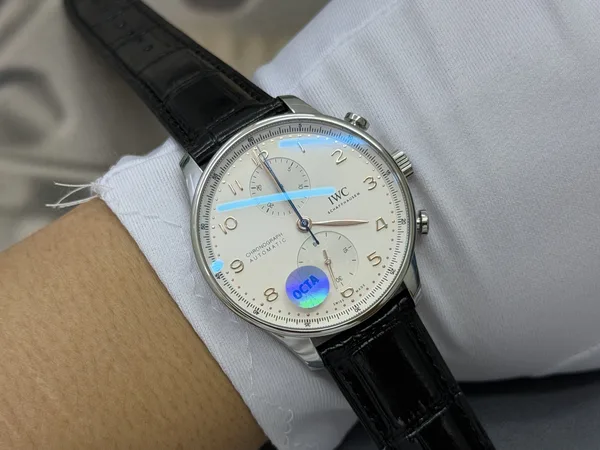 OCTA Portugieser Chronograph, silver dial with gold hands, black leather strap, on the wrist