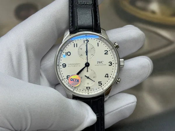 OCTA Portugieser Chronograph, silver dial with blue hands, black leather strap, dial view