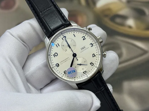 OCTA Portugieser Chronograph, silver dial with blue hands, black leather strap, angled dial view